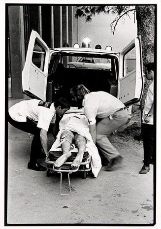 Untitled (Medics Lift Wounded Striker into Ambluance)