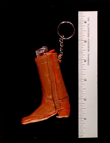 Exhibit H: Cowboy Boot, Lighter, Assaulted (from the series Crime in the Home)