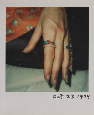 Untitled (Woman's hand with rings)