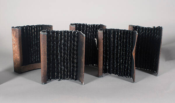 Five steel pieces with graphite powder by Paula Castillo, “Cinco Barrios”