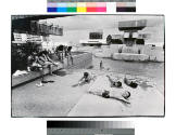Miguel A. Gandert, Bathers, First Plaza, Albuquerque, 1983, chloro-bromide print, toned, 12 7/1…