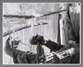 A Navaho Weaver's Hands in the Weft