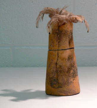 Untitled (clay vessel with feathers)