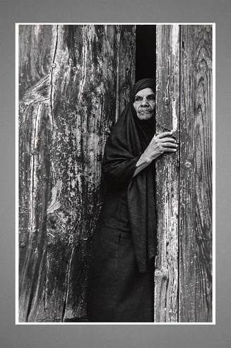 Silver gelatin print of woman at her door