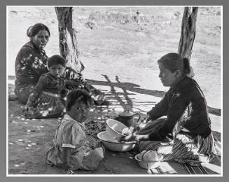 Washing Dishes under a Summer Shelter