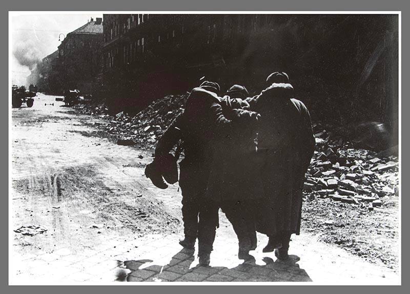 Two soldiers helping a wounded comrade, Austria