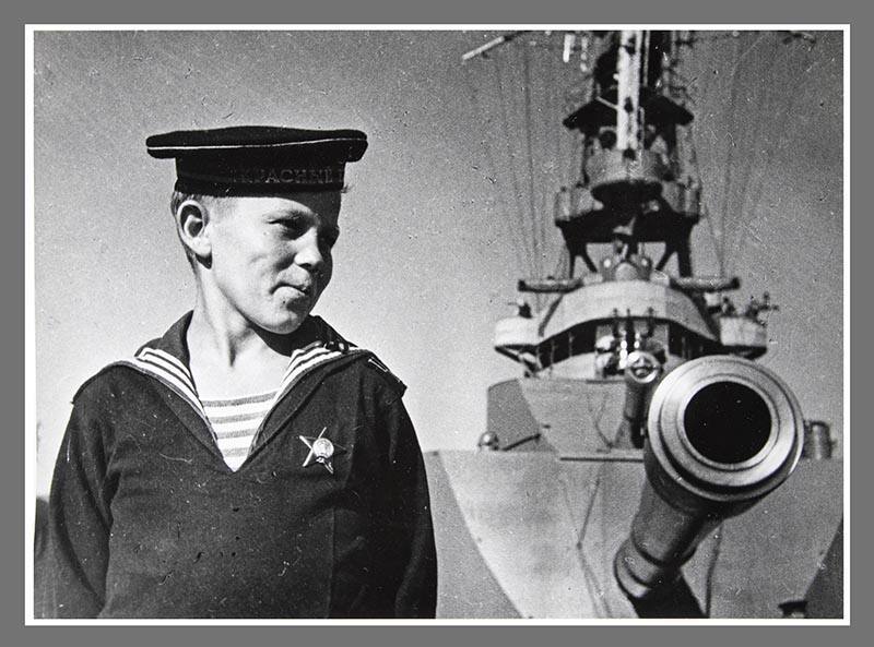 Young sailor by cannon