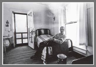 Untitled (Man on bed, smoking)