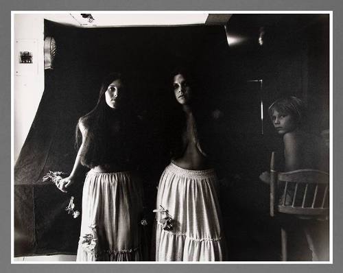Untitled (Two women in tiered skirts with child)