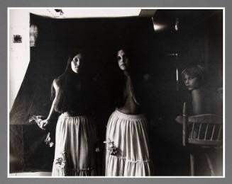 Untitled (Two women in tiered skirts with child)