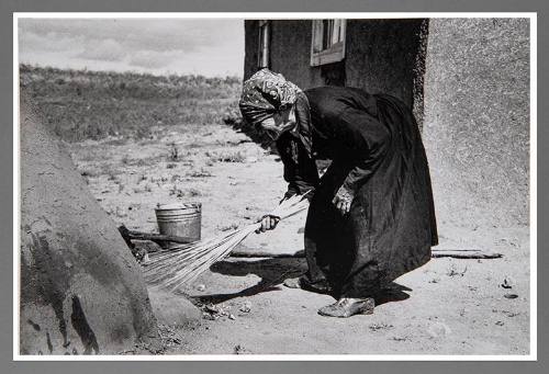 Taos Vicinity: Sweeping Coals from Outdoors Oven
