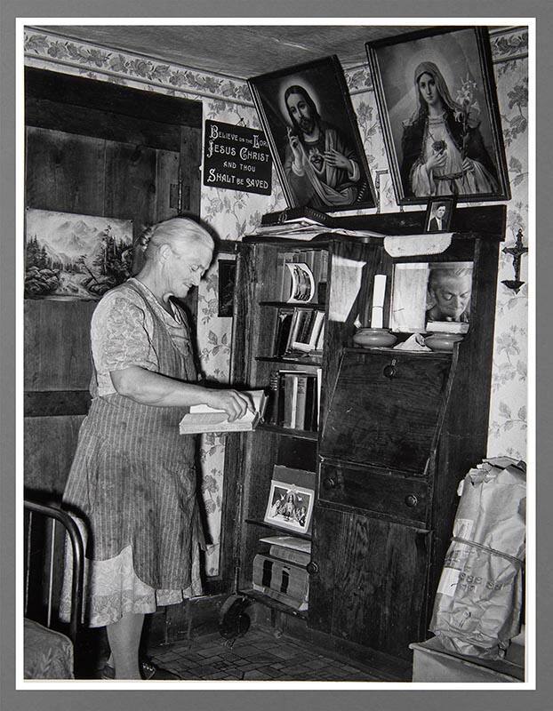 Pie Town, New Mexico. Mrs. George Hutton In Front of Bookcase