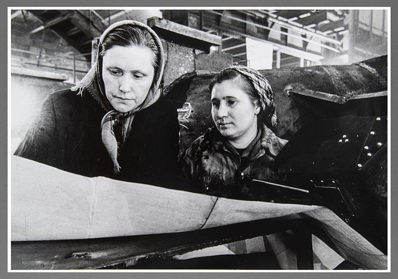Two Women With Blue Prints