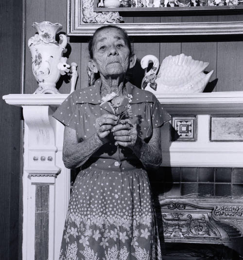 Untitled (Puerto Rican woman with flower)