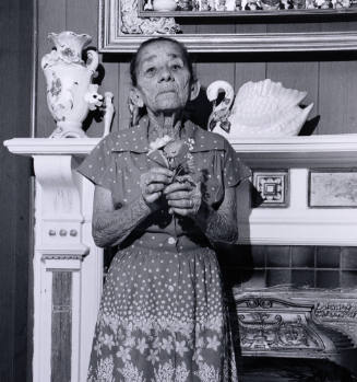 Untitled (Puerto Rican woman with flower)