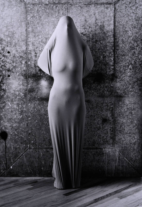 Wrapped Woman at Steel Door