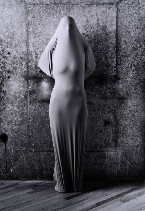 Wrapped Woman at Steel Door
