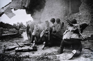 Group of soldiers firing cannon