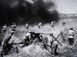Soldiers advancing in a field