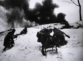 Soldiers pulling small cannon