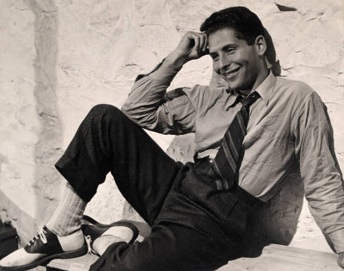 Man Seated by Wall