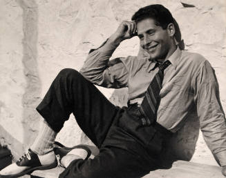 Man Seated by Wall