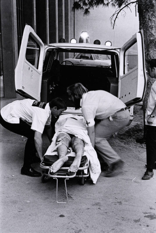 Untitled (Medics Lift Wounded Striker into Ambluance)