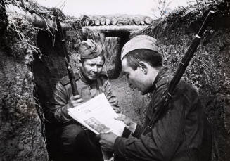 Reading an Uzbeck newspaper