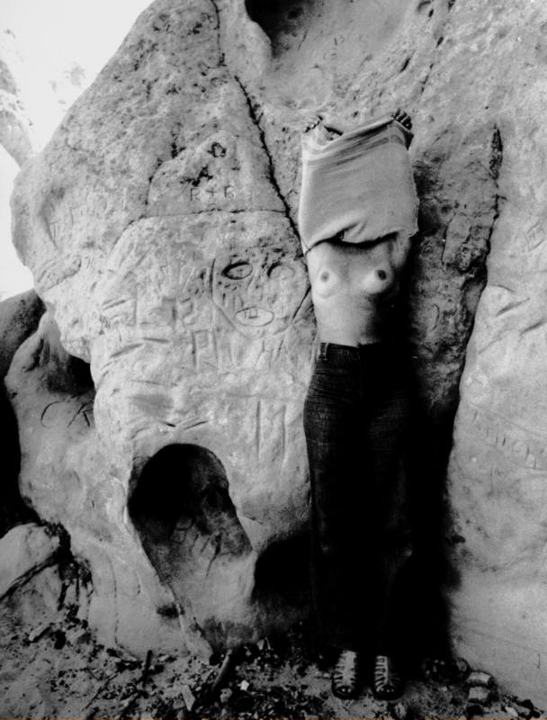Untitled (Nude woman with rock carvings)