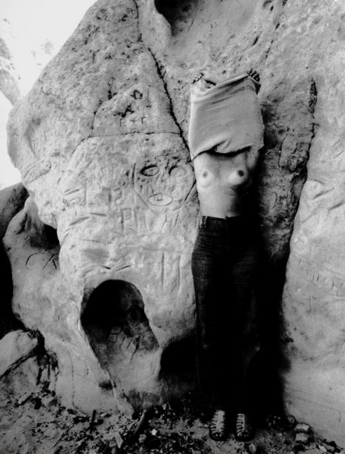Untitled (Nude woman with rock carvings)