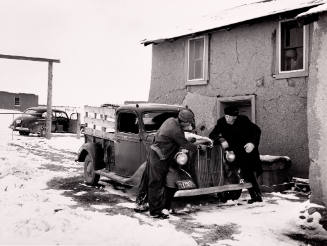 Father Cassidy Helps Fix a Car