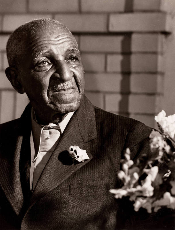 Untitled (Elderly Man in Suit with Flowers)