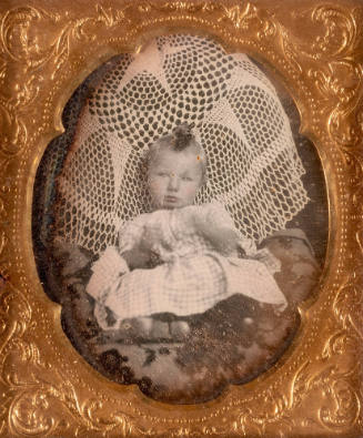 Untitled (Child with a Crocheted Blanket)