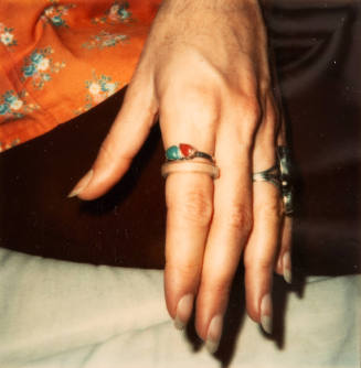 Untitled (Woman's hand with rings)