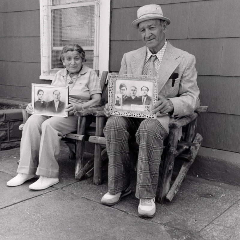 Untitled (Nuncio and wife with photographs)
