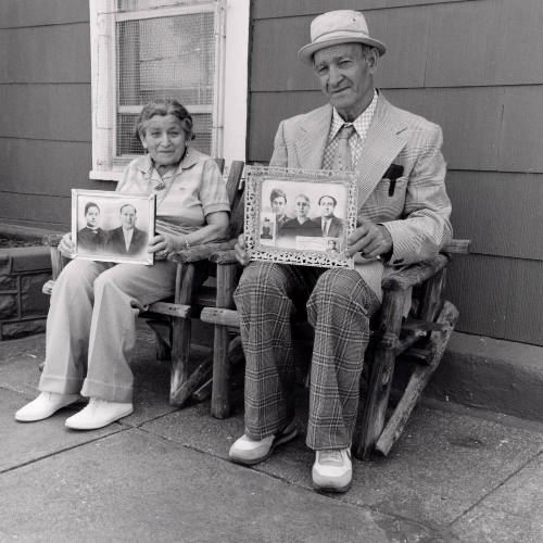 Untitled (Nuncio and wife with photographs)