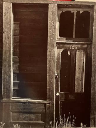 Untitled (Locked door with broken windows)